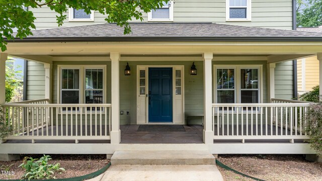 property entrance with covered porch