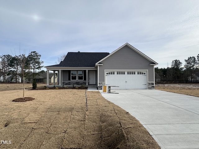 view of front of home with a garage and a porch