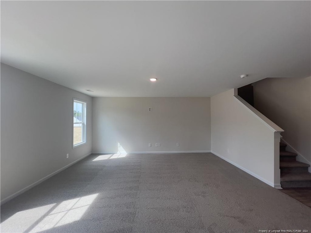 unfurnished living room with carpet flooring