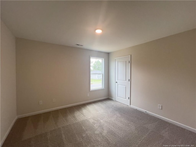 spare room with carpet flooring