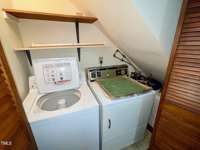 clothes washing area featuring independent washer and dryer