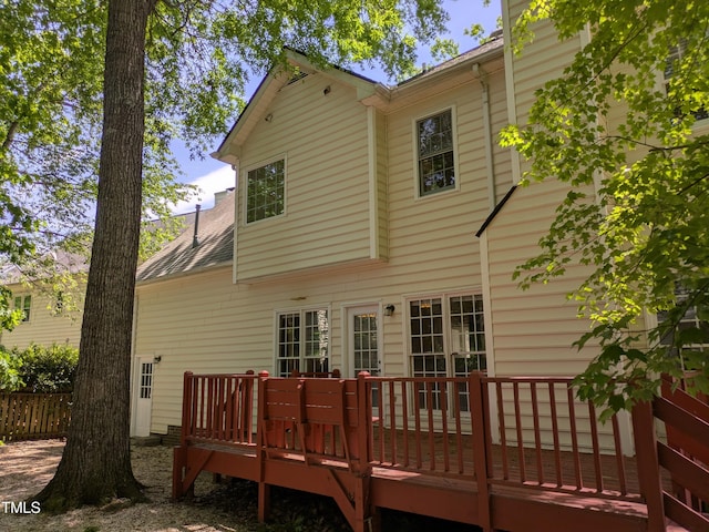 back of house featuring a deck