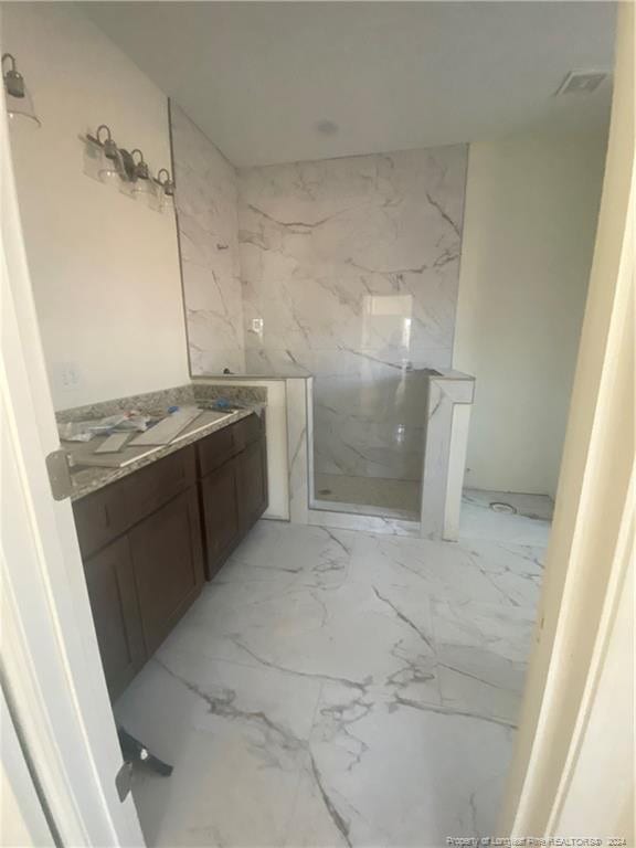 bathroom with vanity and walk in shower