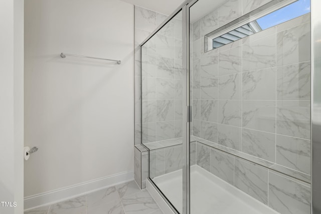 bathroom featuring a shower with door and tile patterned flooring