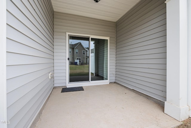 entrance to property with a patio