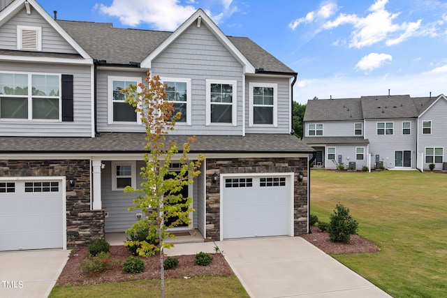 view of front of home with a garage and a front yard