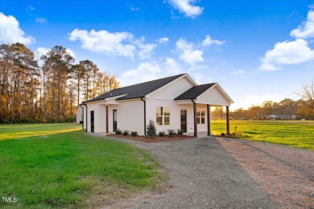 modern farmhouse style home with a front yard