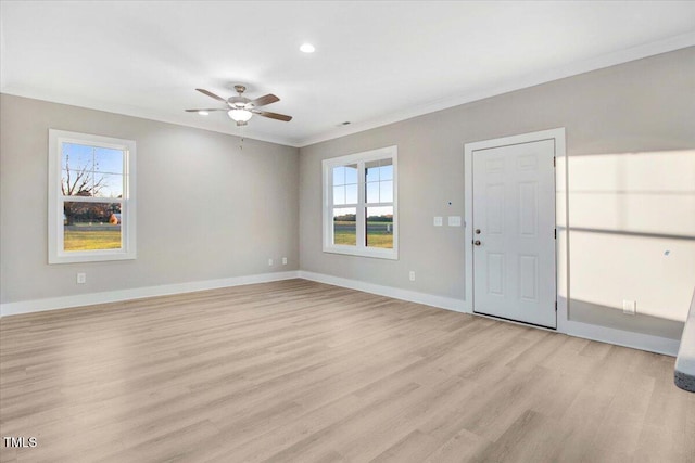 interior space with light hardwood / wood-style flooring, plenty of natural light, crown molding, and ceiling fan