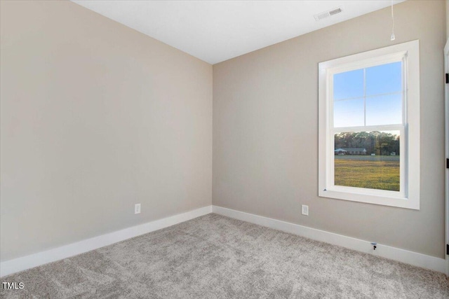 unfurnished room with light colored carpet