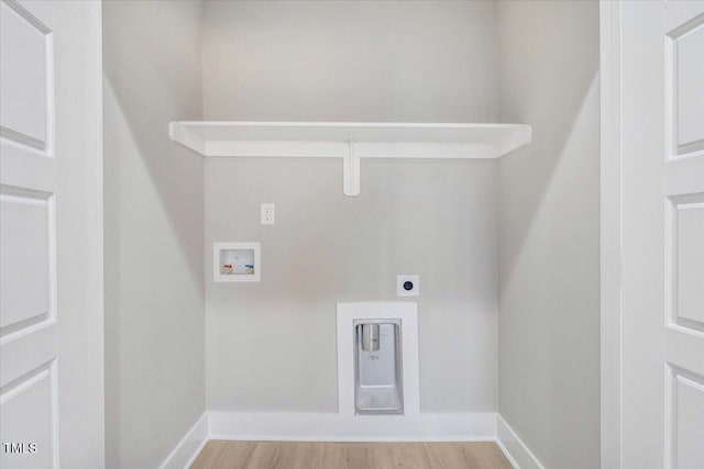 laundry room with electric dryer hookup, washer hookup, and light wood-type flooring