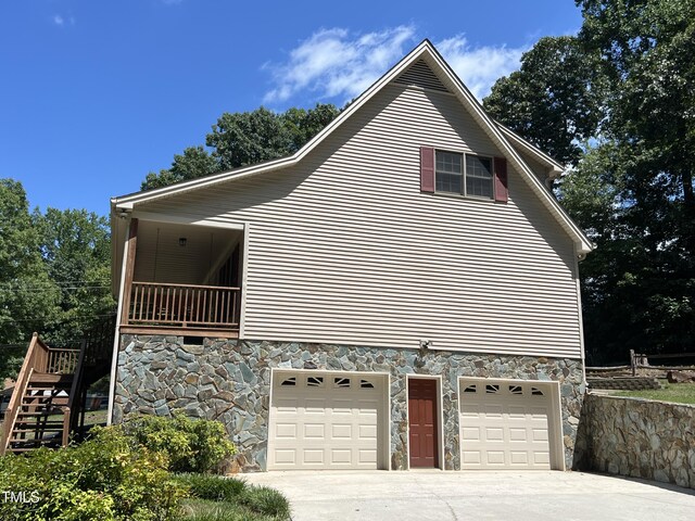 view of side of property with a garage