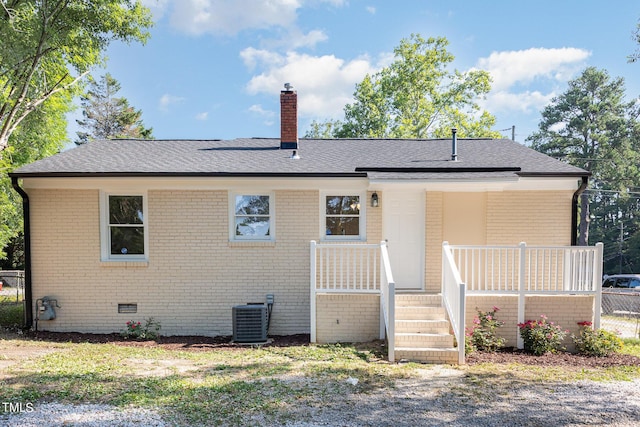 back of house featuring cooling unit