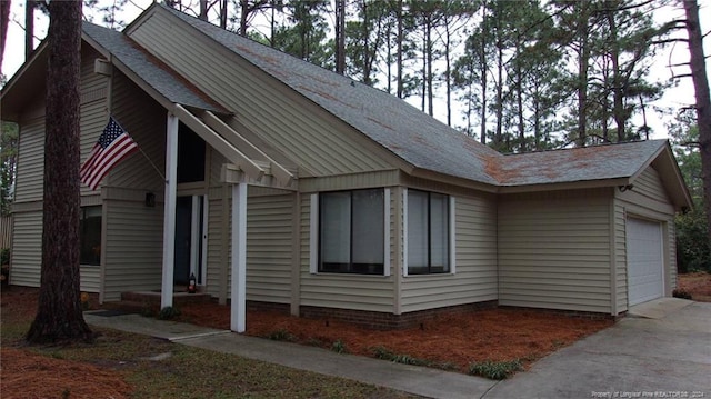 view of front of property with a garage