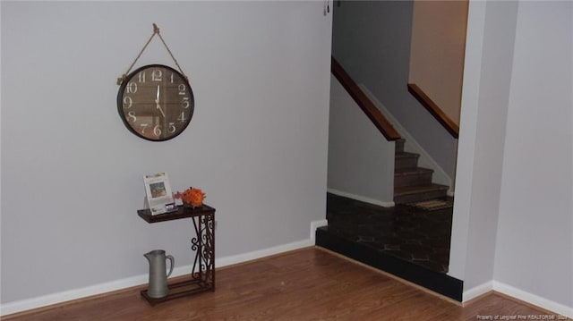 stairway with hardwood / wood-style flooring