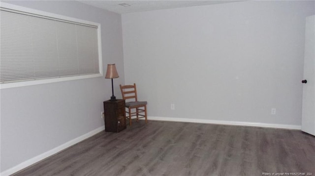 empty room with dark hardwood / wood-style floors