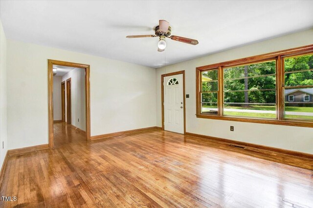 325 Bell St, Enfield, NC 27823 - empty room featuring light wood finished floors and ceiling fan