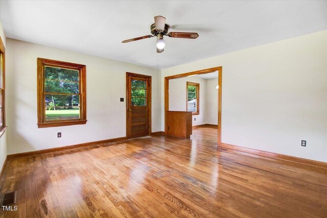 325 Bell St, Enfield, NC 27823 - spare room with light wood-style flooring and a ceiling fan