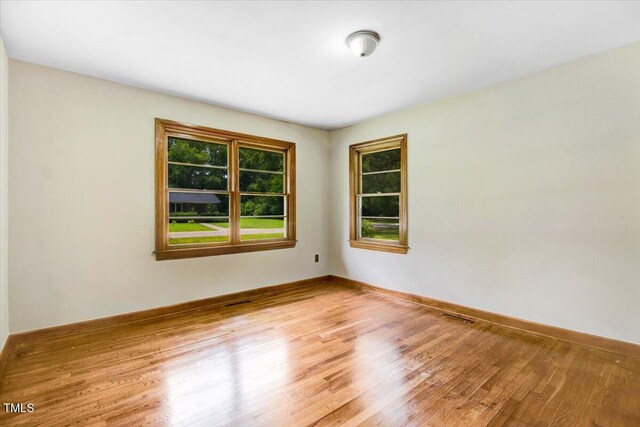 325 Bell St, Enfield, NC 27823 - empty room featuring wood finished floors and baseboards