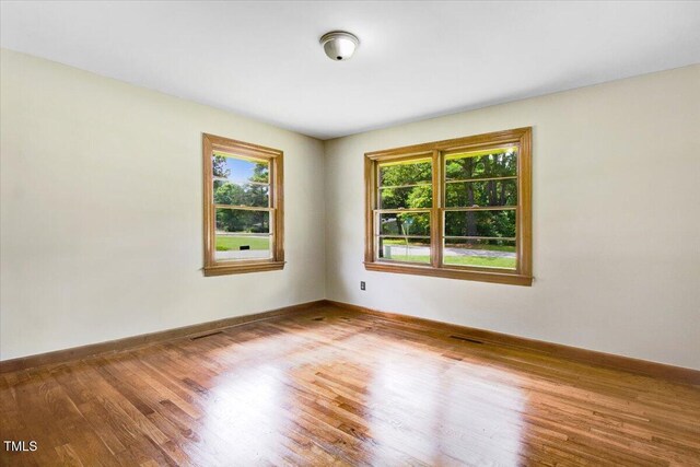 325 Bell St, Enfield, NC 27823 - unfurnished room featuring wood finished floors and baseboards