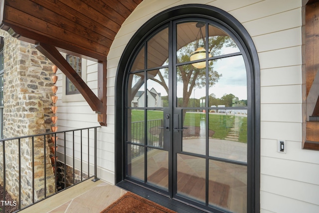 entrance to property featuring french doors