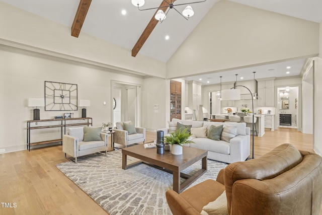 living room featuring recessed lighting, high vaulted ceiling, and light wood-style floors