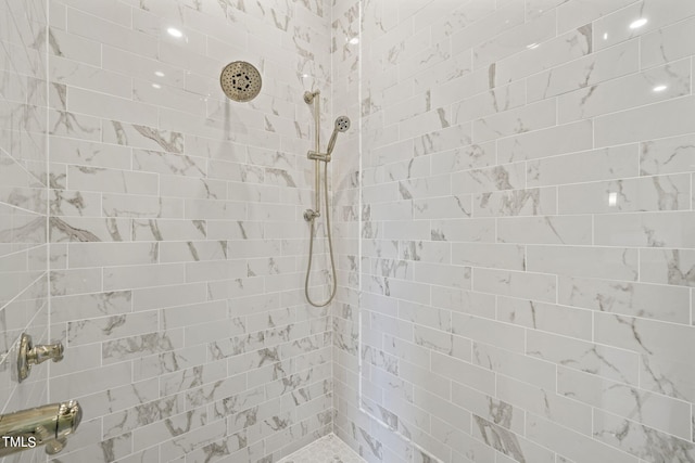 bathroom with tiled shower