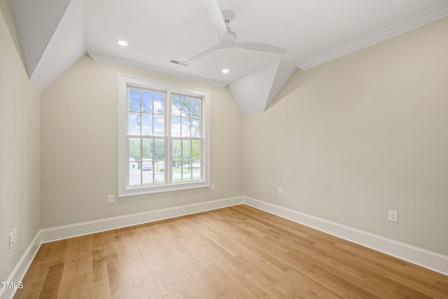 additional living space featuring vaulted ceiling, ceiling fan, baseboards, and light wood-type flooring