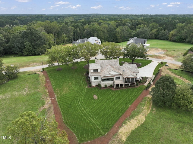 aerial view with a wooded view
