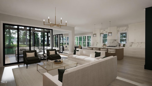 living area with a healthy amount of sunlight, light wood-style floors, ornamental molding, and a notable chandelier