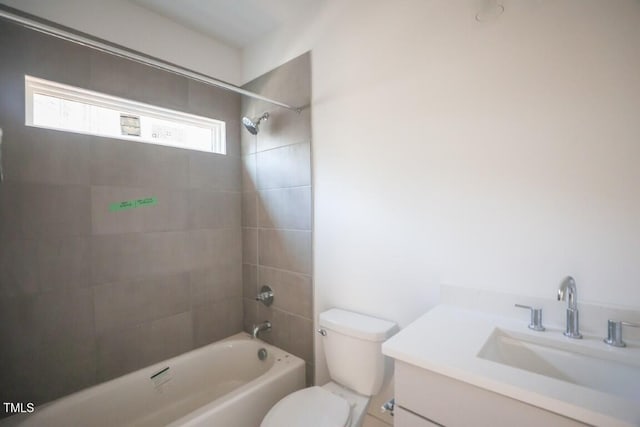 full bathroom with vanity, toilet, and tiled shower / bath