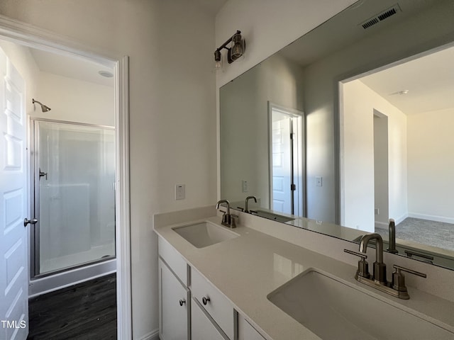 bathroom with vanity and an enclosed shower