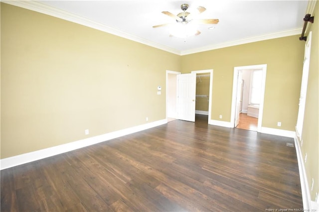 unfurnished bedroom with ceiling fan, ornamental molding, dark wood-type flooring, and ensuite bath