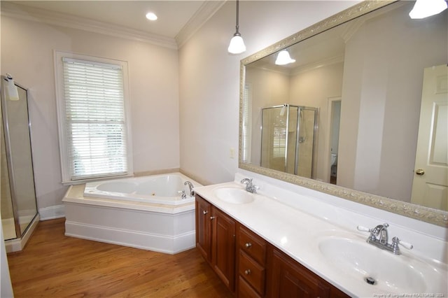 full bathroom with hardwood / wood-style floors, vanity, ornamental molding, and plus walk in shower