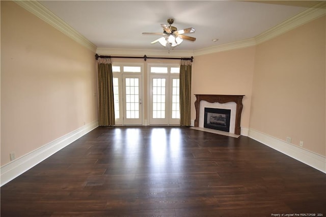 unfurnished living room with ceiling fan, dark hardwood / wood-style flooring, a high end fireplace, and ornamental molding