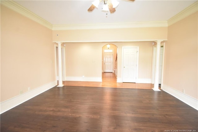 unfurnished room with dark hardwood / wood-style floors, ornate columns, and crown molding