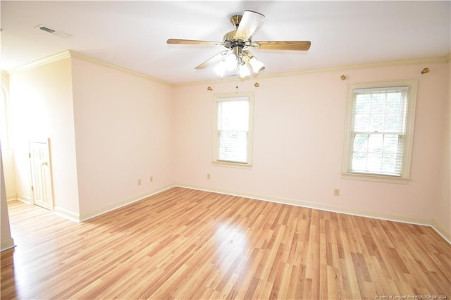 unfurnished room with light hardwood / wood-style floors, ceiling fan, and crown molding