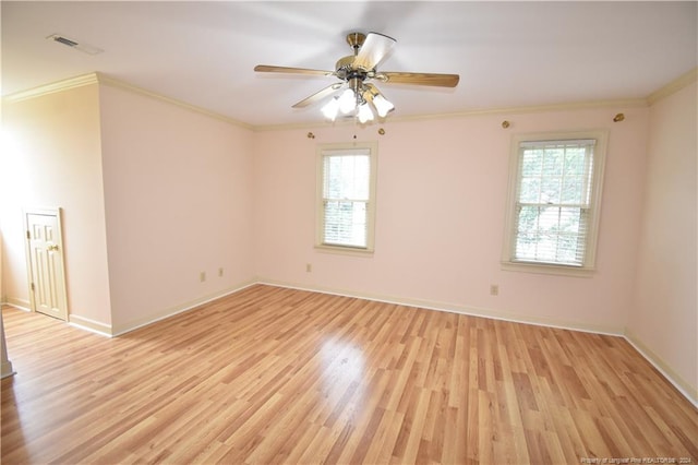 spare room featuring light hardwood / wood-style flooring, ceiling fan, and crown molding