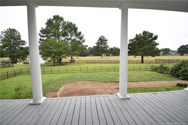 wooden deck with a lawn