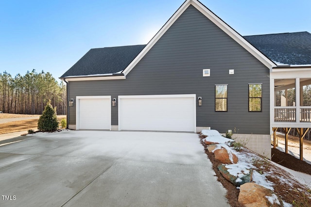 view of side of home with a garage