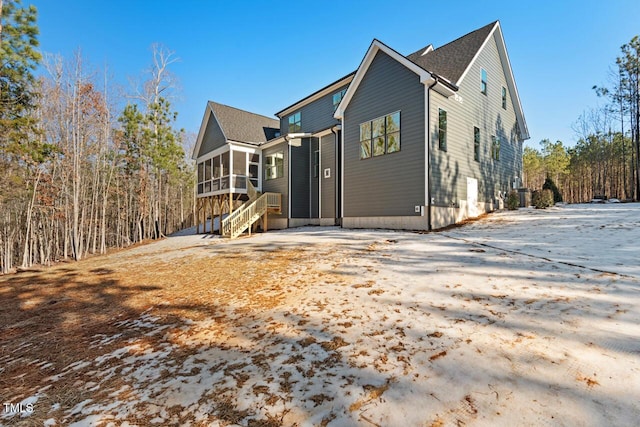 rear view of house with a sunroom