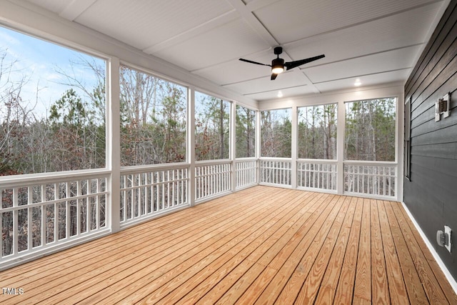 unfurnished sunroom featuring coffered ceiling and ceiling fan