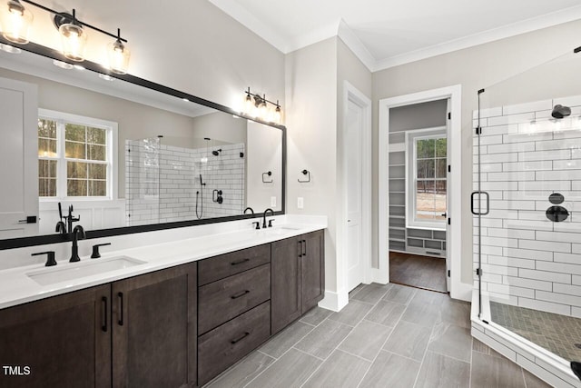 bathroom featuring vanity, ornamental molding, an enclosed shower, and tile patterned floors