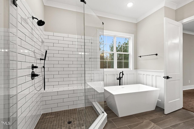 bathroom featuring ornamental molding and plus walk in shower