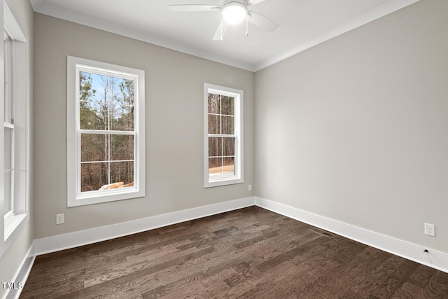 empty room with ornamental molding, dark hardwood / wood-style floors, and ceiling fan