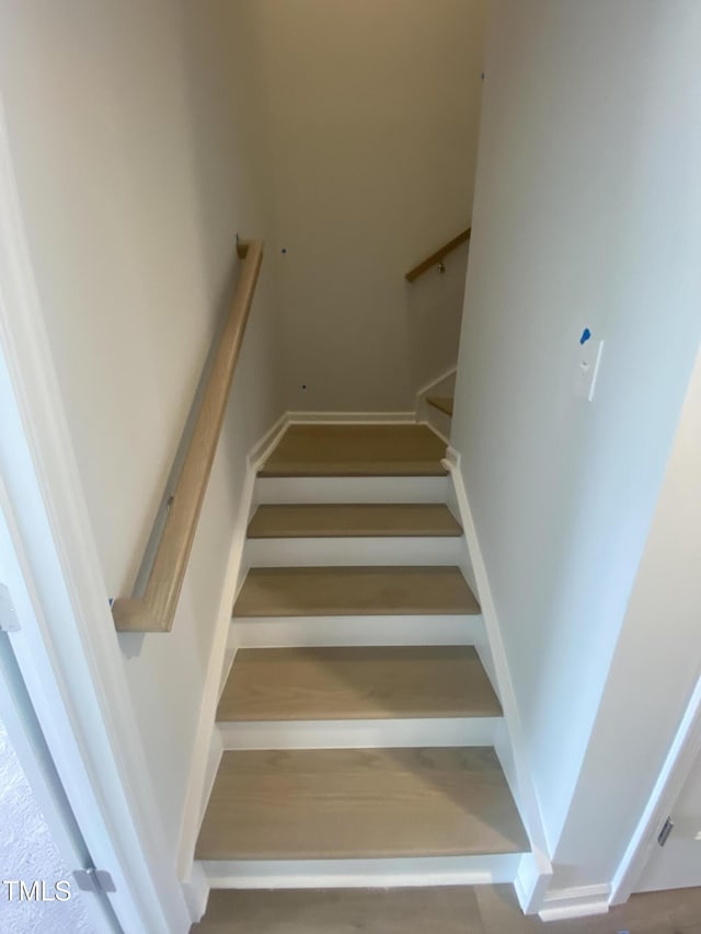 staircase with baseboards