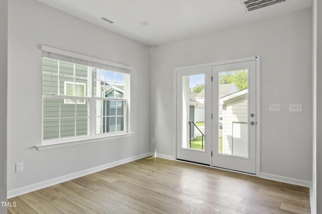 9249 Kitchin Farms Way Unit 432, Wake Forest, NC 27587 - spare room with healthy amount of natural light, wood-type flooring, and baseboards