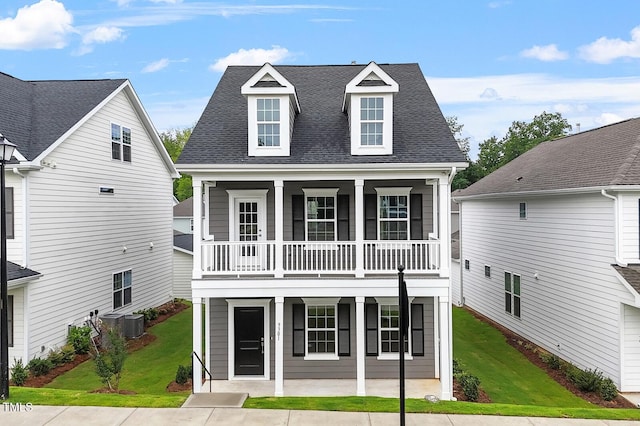 9301 Kitchin Farms Way Unit 433, Wake Forest, NC 27587 - view of front facade with covered porch, roof with shingles, a front yard, and a balcony