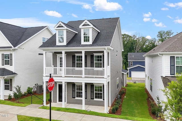 9301 Kitchin Farms Way Unit 433, Wake Forest, NC 27587 - view of front of property with a front lawn, roof with shingles, a balcony, and covered porch