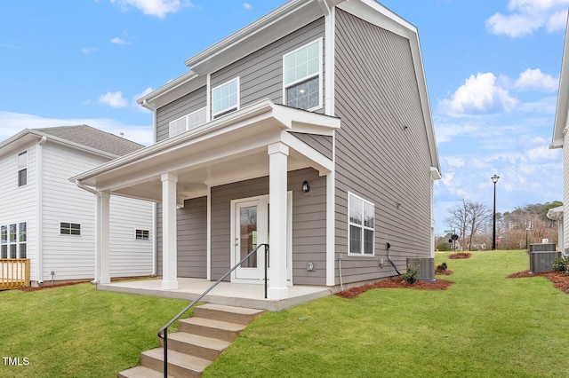 9301 Kitchin Farms Way Unit 433, Wake Forest, NC 27587 - view of front facade with a front lawn, central AC unit, and a porch