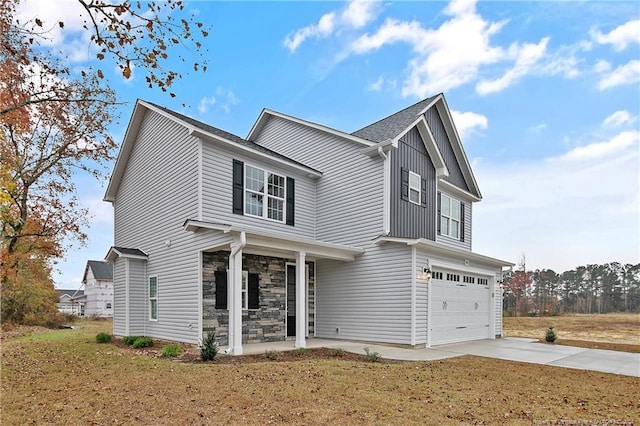 view of front of house featuring a front yard and a garage